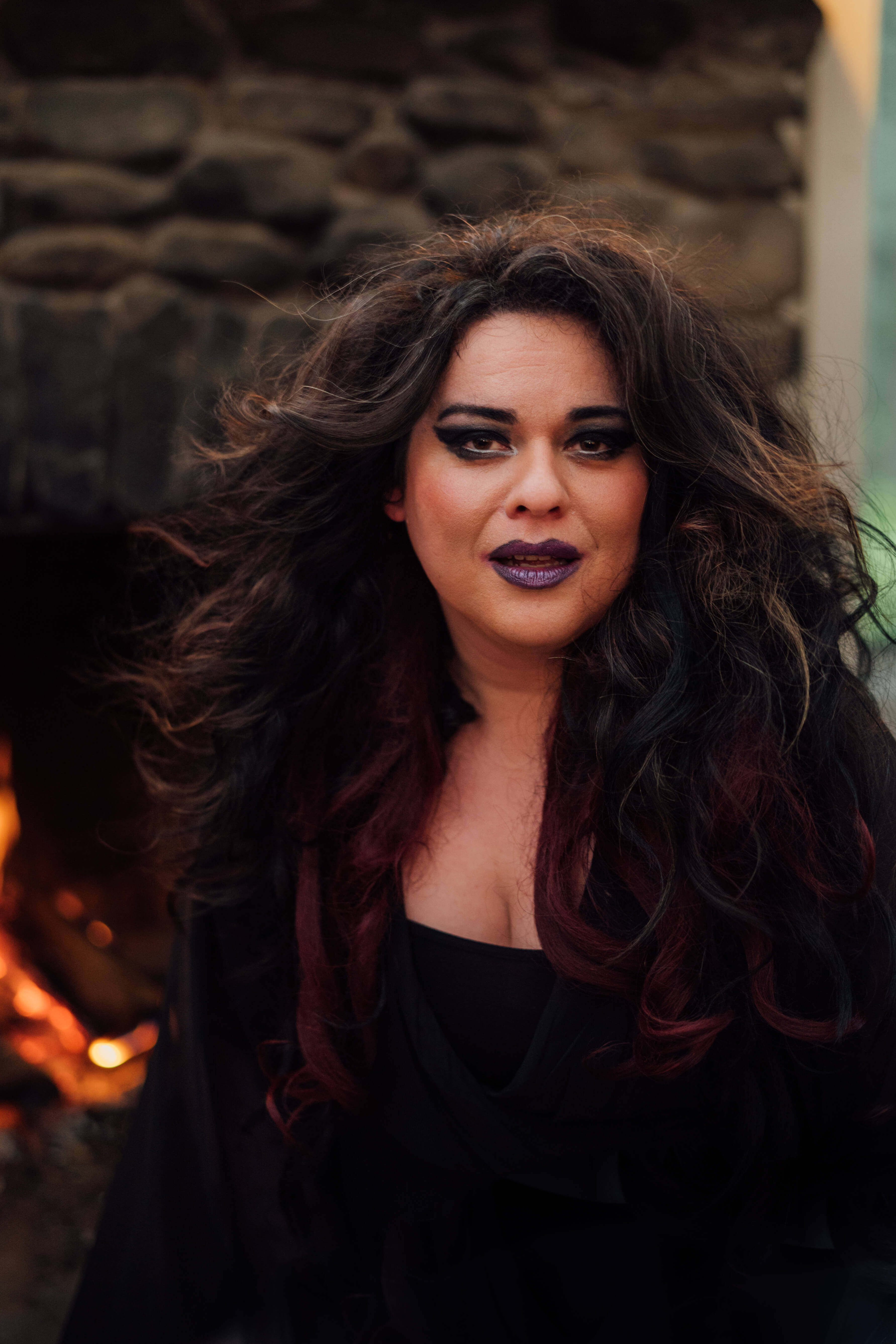 Editorial portrait by firelight